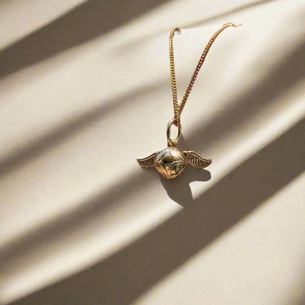 Harry Potter Quidditch Golden Snitch Women's Necklace with Hogwarts Emblem - Harry Potter -