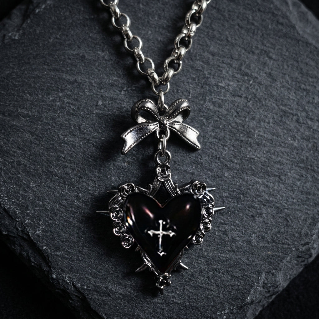 gothic heart necklace, thorn heart pendant, heart cross necklace, gothic bow necklace, red heart gothic jewelry, black heart pendant, purple gothic necklace, dark romantic jewelry, silver rose thorn necklace, gothic Valentine jewelry, vintage punk necklace, Y2K gothic accessories, gothic Lolita jewelry, vampire inspired necklace, unisex gothic jewelry, heart with cross necklace, alternative fashion jewelry, romantic goth necklace, silver bow pendant, dark coquette jewelry
