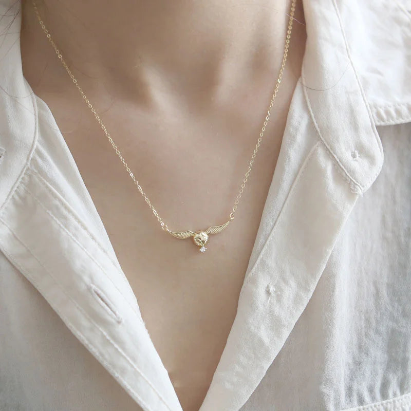 Harry Potter Quidditch Golden Snitch Women's Necklace with Hogwarts Emblem - Harry Potter -