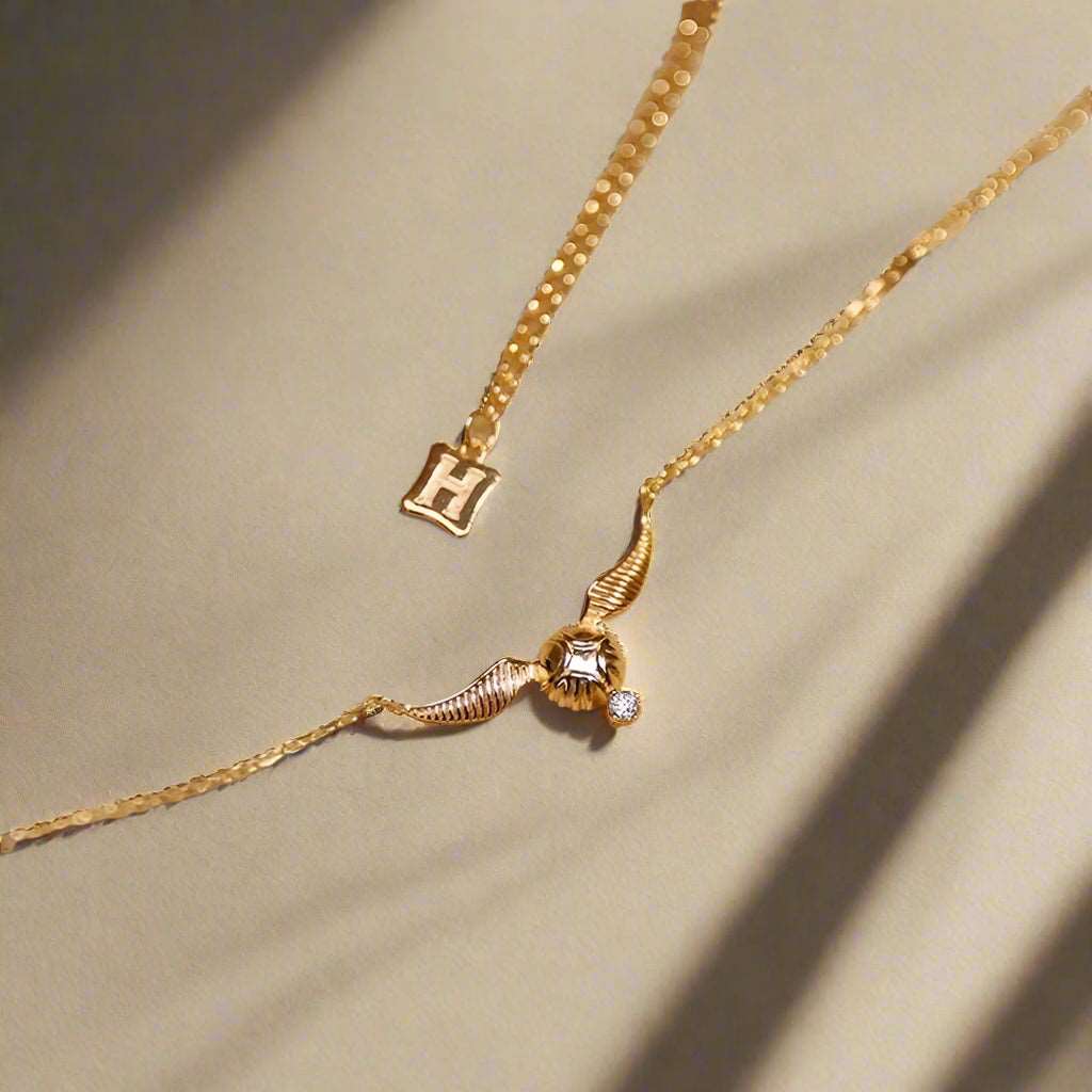 Harry Potter Quidditch Golden Snitch Women's Necklace with Hogwarts Emblem - Harry Potter - 
