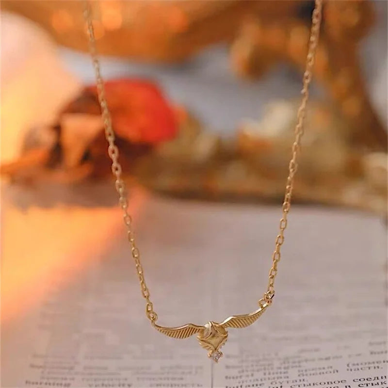 Harry Potter Quidditch Golden Snitch Women's Necklace with Hogwarts Emblem - Harry Potter - 