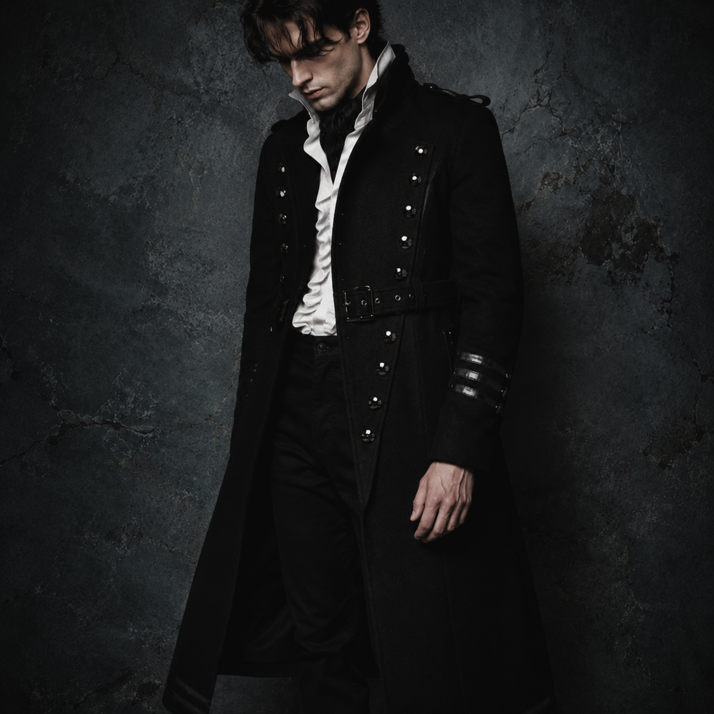 Man wearing black gothic military long coat with double breasted metal buttons and structured high collar