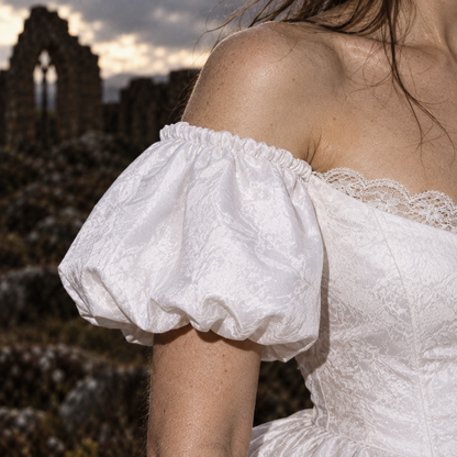 Wuthering Heights wedding dress, Catherine Earnshaw wedding gown, Catherine Earnshaw bridal costume, Wuthering Heights white dress, Wuthering Heights 2026 costume, Catherine Earnshaw cosplay dress, Margot Robbie inspired wedding dress, gothic Victorian wedding dress, Victorian bridal ball gown, white gothic wedding gown, off shoulder wedding dress with veil, white puff sleeve bridal gown, pointed waist wedding dress, basque waist bridal gown, gothic romance wedding dress, historical wedding costume, Victori