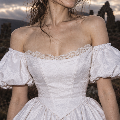 Wuthering Heights wedding dress, Catherine Earnshaw wedding gown, Catherine Earnshaw bridal costume, Wuthering Heights white dress, Wuthering Heights 2026 costume, Catherine Earnshaw cosplay dress, Margot Robbie inspired wedding dress, gothic Victorian wedding dress, Victorian bridal ball gown, white gothic wedding gown, off shoulder wedding dress with veil, white puff sleeve bridal gown, pointed waist wedding dress, basque waist bridal gown, gothic romance wedding dress, historical wedding costume, Victori
