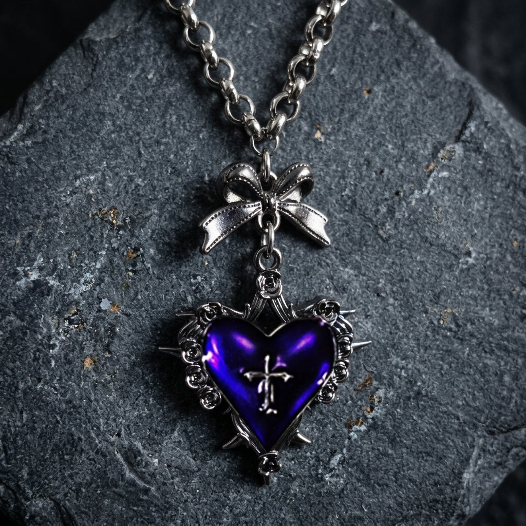 gothic heart necklace, thorn heart pendant, heart cross necklace, gothic bow necklace, red heart gothic jewelry, black heart pendant, purple gothic necklace, dark romantic jewelry, silver rose thorn necklace, gothic Valentine jewelry, vintage punk necklace, Y2K gothic accessories, gothic Lolita jewelry, vampire inspired necklace, unisex gothic jewelry, heart with cross necklace, alternative fashion jewelry, romantic goth necklace, silver bow pendant, dark coquette jewelry