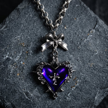 gothic heart necklace, thorn heart pendant, heart cross necklace, gothic bow necklace, red heart gothic jewelry, black heart pendant, purple gothic necklace, dark romantic jewelry, silver rose thorn necklace, gothic Valentine jewelry, vintage punk necklace, Y2K gothic accessories, gothic Lolita jewelry, vampire inspired necklace, unisex gothic jewelry, heart with cross necklace, alternative fashion jewelry, romantic goth necklace, silver bow pendant, dark coquette jewelry