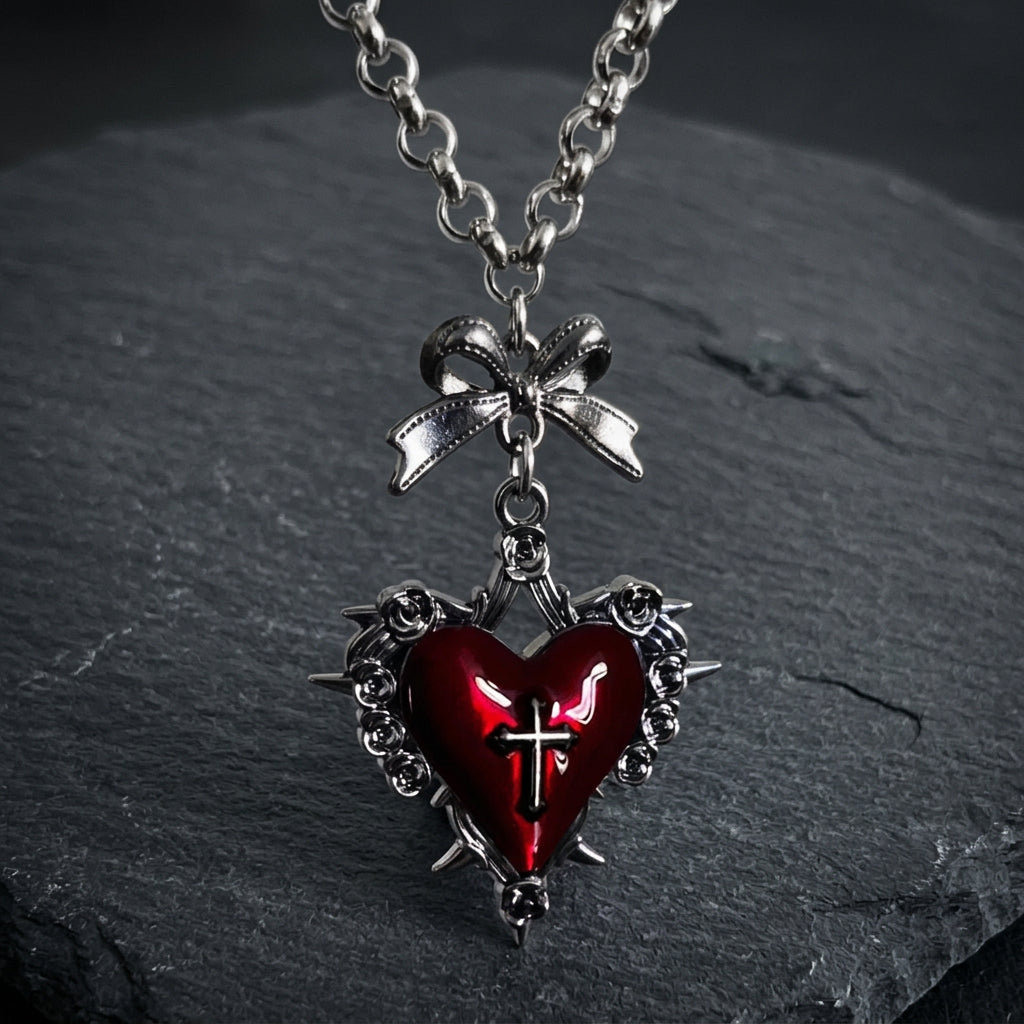 gothic heart necklace, thorn heart pendant, heart cross necklace, gothic bow necklace, red heart gothic jewelry, black heart pendant, purple gothic necklace, dark romantic jewelry, silver rose thorn necklace, gothic Valentine jewelry, vintage punk necklace, Y2K gothic accessories, gothic Lolita jewelry, vampire inspired necklace, unisex gothic jewelry, heart with cross necklace, alternative fashion jewelry, romantic goth necklace, silver bow pendant, dark coquette jewelry
