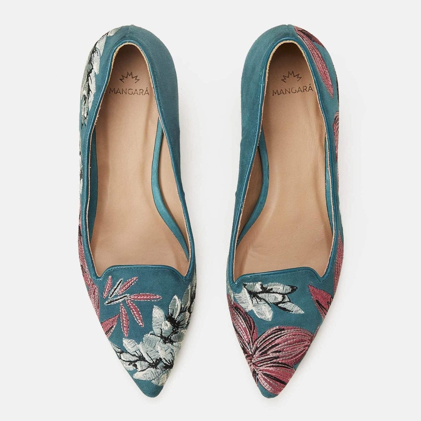 Pair of teal pointed-toe shoes with floral embroidery on a white background